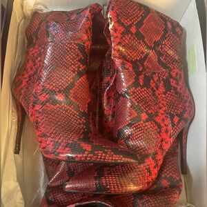 Steve Madden thigh high boots

Red and black snakeskin, size 9, Never worn
